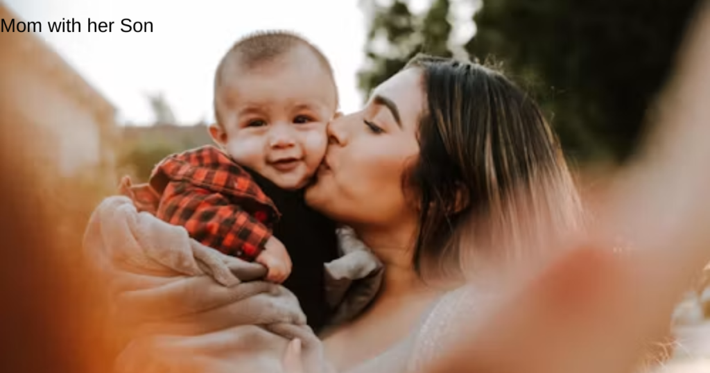 Mother kissing her child during a loving family moment