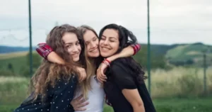 Close friends sharing a meaningful moment outdoors